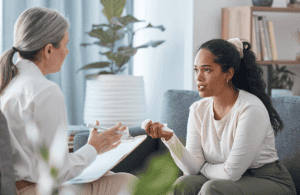 a therapist and patient discuss the benefits of outpatient treatment
