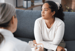 a person talks to a therapist about detox program faq