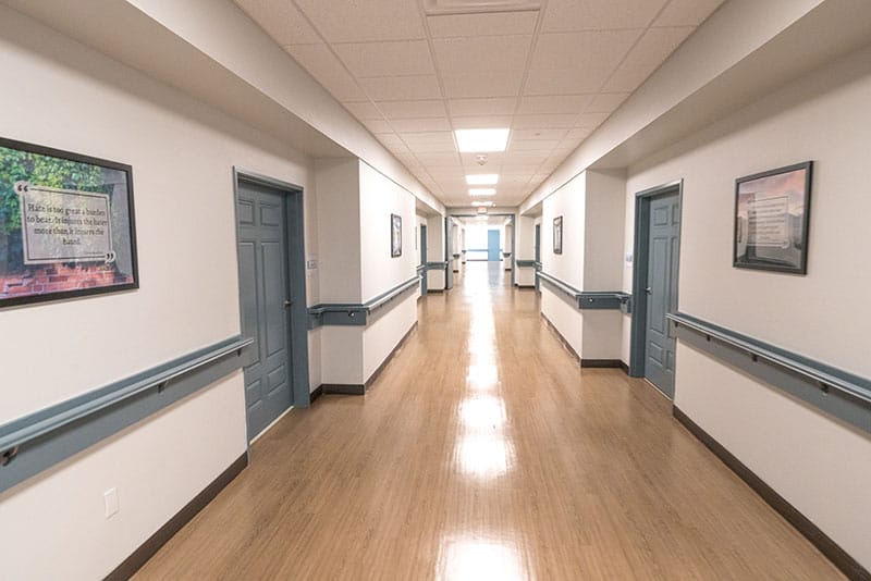 Clean and brightly lit hallway at the center for addiction therapy services at Virtue Recovery Center