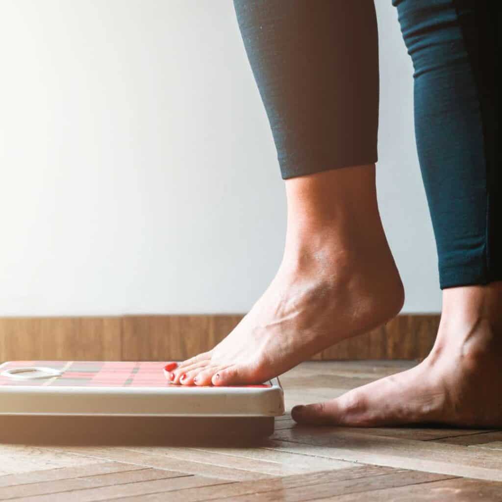 What is ARFID Avoidant Restrictive Food Intake Disorder Person Stepping on Scale